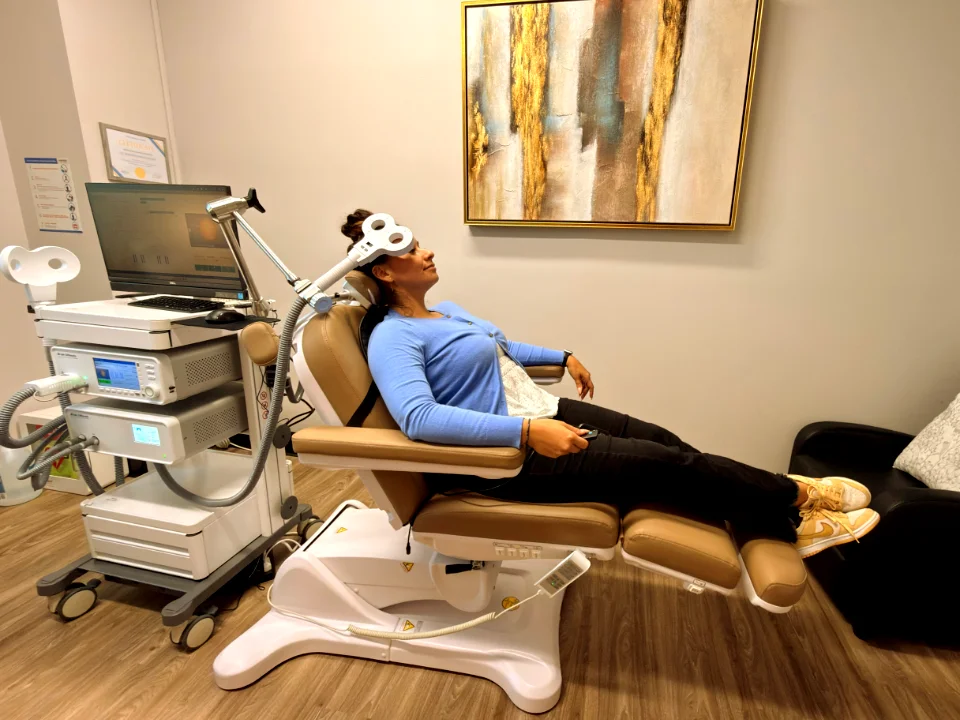 A patient receiving TMS therapy in a comfortable treatment chair at Healing TMS Clinic in Anaheim.